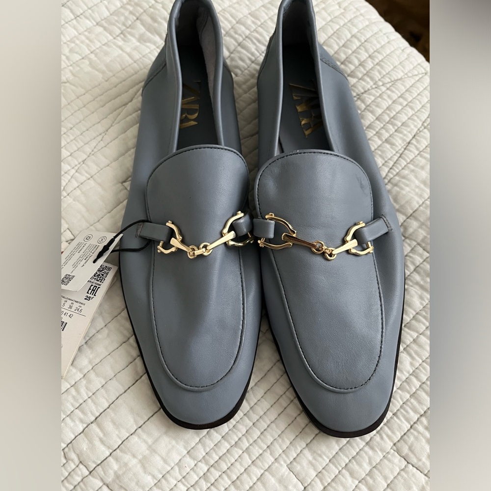 Zara blue leather loafers with metal buckle.